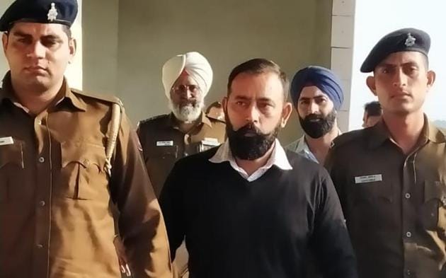 Harmehtab Singh Rarewala being escorted out of a Chandigarh court after he was sentenced to life imprisonment till natural death on Wednesday.(HT Photo)