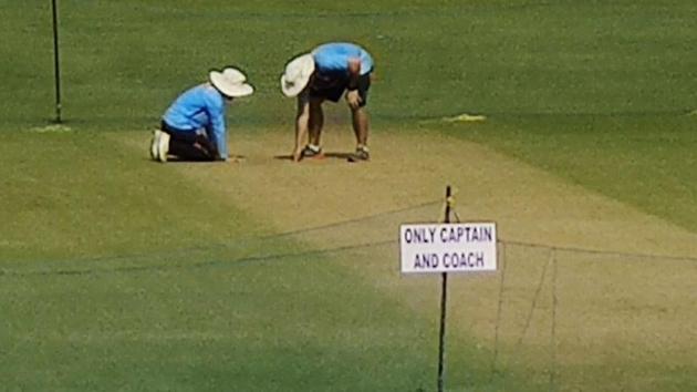 Officials inspecting the Eden Gardens pitch. (HT Photo) Officials inspecting the Eden Gardens pitch. (HT Photo)