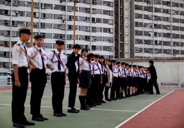 Pastor Alan Keung helps to arrange his pupils to stand in a straight line during an activity. Keung said he had woven into his preaching some lessons he learnt from the protests. “Don’t feel like you’re not part of this,” he told a recent church gathering, as uniformed children listened wide-eyed. “Every one of you is the future of Hong Kong and the world. Every one of you is involved.” (Kim Kyung-Hoon / REUTERS)