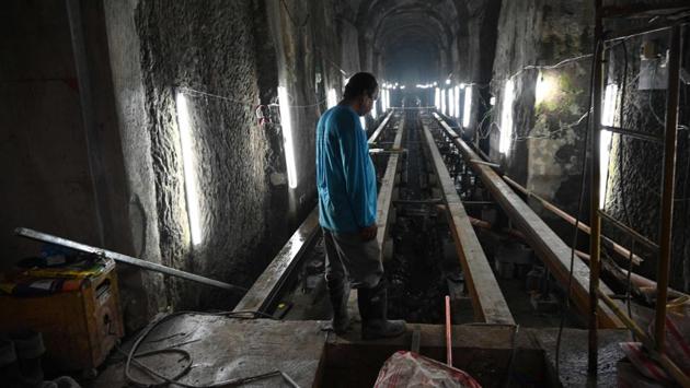 A worker stands near the entrance of the El Deposito, a Spanish-era water reservoir being rehabilitated for tourism, in San Juan town, Manila. Vaulted ceilings and rows of stone columns stretch into the humid darkness deep below the Philippine capital, where workers are transforming a more than century-old underground reservoir into a draw for tourists. (Ted ALJIBE / AFP)