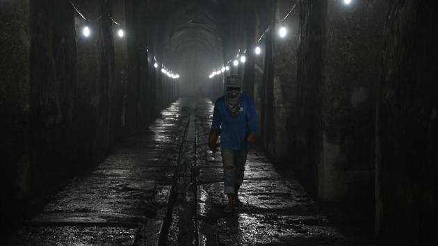 A worker walks inside at the El Deposito. The reservoir, which was built toward the end of Spanish control, was a major advancement for the residents of Manila. Before then, water was scooped out of the river and delivered to the capital’s homes by porters lugging large clay jars. “We always think the Spaniards treated us so badly at that time, but somehow they have given us the (means) to provide clean water for Filipinos,” Oliveros said. (Ted ALJIBE / AFP)