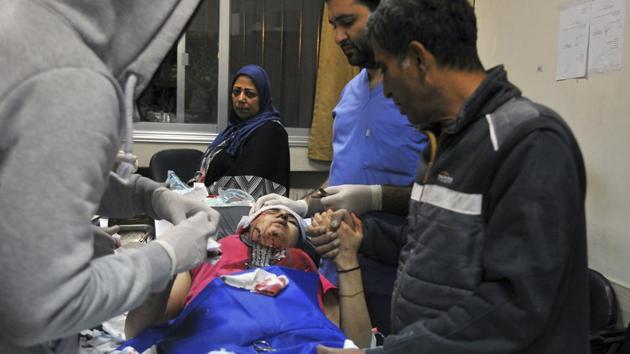 In this photo released by the Syrian official news agency SANA, a paramedic treats an injured woman wounded by Israeli missile strikes at a hospital in Damascus, Syria on Wednesday. (AP) In this photo released by the Syrian official news agency SANA, a paramedic treats an injured woman wounded by Israeli missile strikes at a hospital in Damascus, Syria on Wednesday. (AP)
