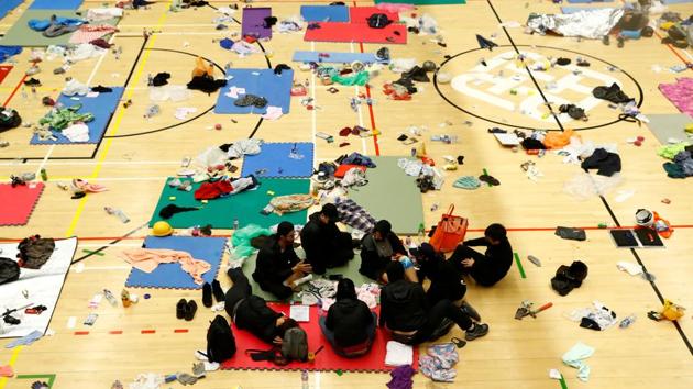 Anti-government protesters rest in the gymnasium. Hong Kong has had a brief respite from months of often violent demonstrations, with relative calm across the city for the past two days and nights ahead of District Council elections set for Sunday. (Thomas Peter / REUTERS)