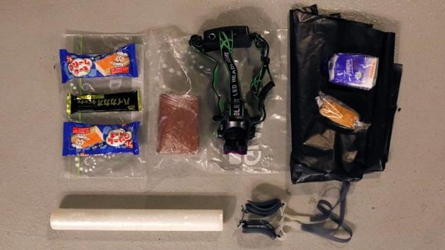 Belongings of an anti-government protester. Trash and debris from homemade petrol bombs were strewn across the grounds. Many protesters abandoned their equipment, including gas masks and umbrellas. (Adnan Abidi / REUTERS)