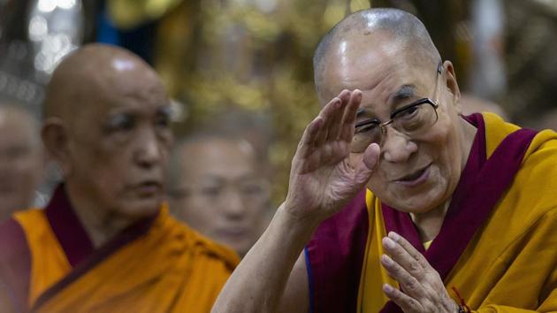 Tibetan spiritual leader the Dalai Lama greets devotees as he arrives to give a religious talk at the Tsuglakhang temple in Dharmsala.(File photo: AP)