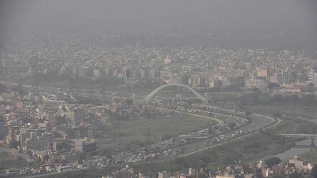 A bird’s eye view of the Signature Bridge engulfed in smog, in New Delhi. Senior officials from the three municipalities in Delhi said that despite orders from the Supreme Court to step up action against pollution, the work on the ground is suffering because they do not have enough waste collection vehicles, manpower, and equipment to deal with garbage and construction and demolition waste. (Sanjeev Verma/ HT Photo) A bird’s eye view of the Signature Bridge engulfed in smog, in New Delhi. Senior officials from the three municipalities in Delhi said that despite orders from the Supreme Court to step up action against pollution, the work on the ground is suffering because they do not have enough waste collection vehicles, manpower, and equipment to deal with garbage and construction and demolition waste. (Sanjeev Verma/ HT Photo)