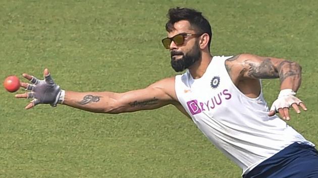 Kolkata: Indian captain Virat Kohli dives to take a catch during a training session.(PTI)