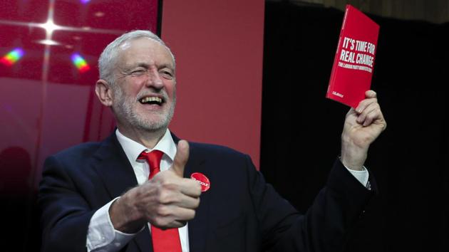 Jeremy Corbyn, leader of Britain's opposition Labour Party, gives a thumbs up holding a copy of the manifesto on stage at the launch of Labour's General Election manifesto, at Birmingham City University, England. Britain goes to the polls on December 12. (Kirsty Wigglesworth / AP) Jeremy Corbyn, leader of Britain's opposition Labour Party, gives a thumbs up holding a copy of the manifesto on stage at the launch of Labour's General Election manifesto, at Birmingham City University, England. Britain goes to the polls on December 12. (Kirsty Wigglesworth / AP)