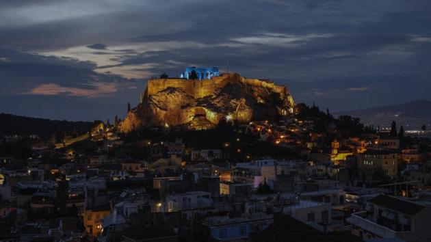 The ancient Parthenon temple atop the Acropolis hill is lit blue during a rehearsal, in Athens. The Acropolis was lit blue for UNICEF's World Children's Day celebrations. (Petros Giannakouris / AP) The ancient Parthenon temple atop the Acropolis hill is lit blue during a rehearsal, in Athens. The Acropolis was lit blue for UNICEF's World Children's Day celebrations. (Petros Giannakouris / AP)