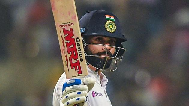 Kolkata: Indian Skipper Virat Kohli raises his bat after scoring half-century on the first day.(PTI)