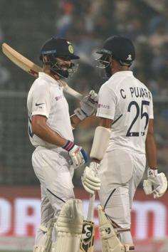 Indian captain Virat Kohli and Cheteshwar Pujara on the first day of India's Pink Ball Test against Bangladesh in Kolkata. (Samir Jana / Hindustan Times)