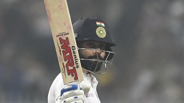 Indian captain Virat Kohli lift his bat to mark his 50 run score. (Samir Jana / Hindustan Times) Indian captain Virat Kohli lift his bat to mark his 50 run score. (Samir Jana / Hindustan Times)