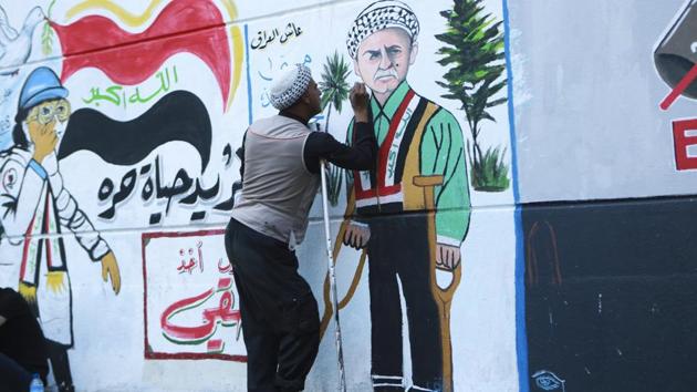 A protestor adds some details and facial expressions to graffiti at the Saadoun Tunnel. Haydar Mohammed said he and a group of other medical students were partly responsible for the murals. They met in Tahrir and saw the tunnels walls were a perfect medium to send a message to those who are suspicious of the protesters, he said. “We are life-makers not death-makers,” he said. “We decided to draw simple paintings to support our protester brothers and to express our message, which is a peace message.” (Hadi Mizban / AP) A protestor adds some details and facial expressions to graffiti at the Saadoun Tunnel. Haydar Mohammed said he and a group of other medical students were partly responsible for the murals. They met in Tahrir and saw the tunnels walls were a perfect medium to send a message to those who are suspicious of the protesters, he said. “We are life-makers not death-makers,” he said. “We decided to draw simple paintings to support our protester brothers and to express our message, which is a peace message.” (Hadi Mizban / AP)