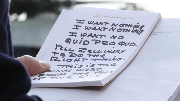 U.S. President Donald Trump holds his notes while speaking to the media before departing from the White House in Washington, DC. President Trump spoke about the impeachment inquiry hearings currently taking place on Capitol Hill. (Mark Wilson / Getty Images / AFP) U.S. President Donald Trump holds his notes while speaking to the media before departing from the White House in Washington, DC. President Trump spoke about the impeachment inquiry hearings currently taking place on Capitol Hill. (Mark Wilson / Getty Images / AFP)