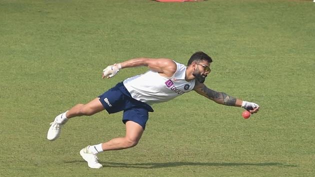 Indian captain Virat Kohli dives to take a catch during a training session(PTI)