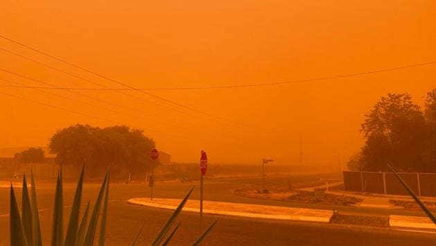 The sky turning orange from dust storms caused by bushfires in Mildura in Victoria state. The fire danger was elevated across wider swathes of southern Australia on November 21, with residents warned to avoid at-risk areas as smoke from bushfires choked Sydney and other major cities. (Handout / Petra Johansson / AFP) The sky turning orange from dust storms caused by bushfires in Mildura in Victoria state. The fire danger was elevated across wider swathes of southern Australia on November 21, with residents warned to avoid at-risk areas as smoke from bushfires choked Sydney and other major cities. (Handout / Petra Johansson / AFP)