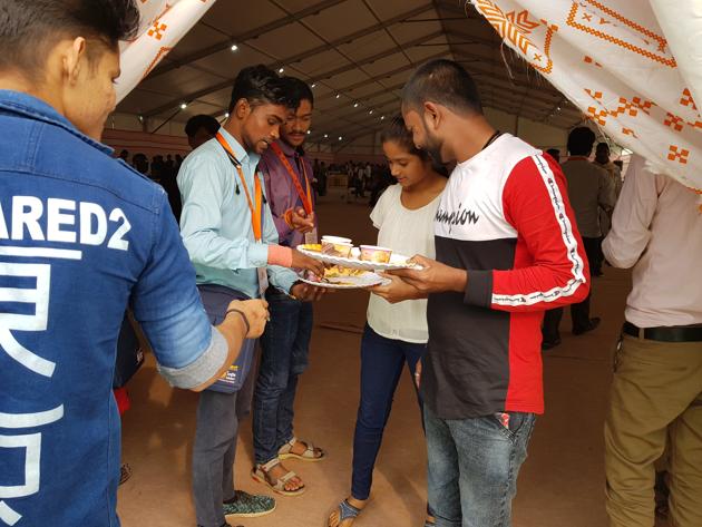 Volunteers at the event are urging visitors to finish their food. (HT Photo) Volunteers at the event are urging visitors to finish their food. (HT Photo)