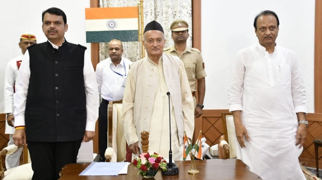 Devendra Fadnavis and Ajit Pawar with Maharashtra Governor Bhagat Singh Koshyari at the oath-taking ceremony at the Raj Bhawan inMumbai on Saturday.(HT Photo)