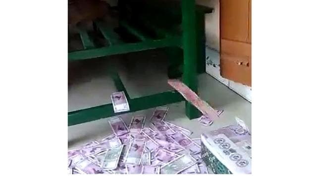 The officers also found a video showing bundles of 2000 rupee notes, said Sanjay Dutta, forest range officer, Belakoba and head of the special task force in north Bengal.(Screengrab of the video/HT)