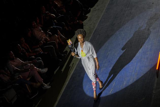 Former 800-meter star and two time world champion, Cuban Ana Fidelia Quirot, wears a creation from "Clandestina," the first Cuban independent urban fashion brand, during a launches for the 2020 collection called Sports Glories in Havana, Cuba, Friday, Nov. 22, 2019. (AP Photo/Ramon Espinosa) (AP) Former 800-meter star and two time world champion, Cuban Ana Fidelia Quirot, wears a creation from "Clandestina," the first Cuban independent urban fashion brand, during a launches for the 2020 collection called Sports Glories in Havana, Cuba, Friday, Nov. 22, 2019. (AP Photo/Ramon Espinosa) (AP)