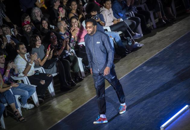 Cuban track and field legend Javier Sotomayor wears a creation from "Clandestina," the first Cuban independent urban fashion brand, during his launches for 2020 collection called Sports Glories in Havana, Cuba, Friday, Nov. 22, 2019. (AP Photo/Ramon Espinosa) (AP) Cuban track and field legend Javier Sotomayor wears a creation from "Clandestina," the first Cuban independent urban fashion brand, during his launches for 2020 collection called Sports Glories in Havana, Cuba, Friday, Nov. 22, 2019. (AP Photo/Ramon Espinosa) (AP)