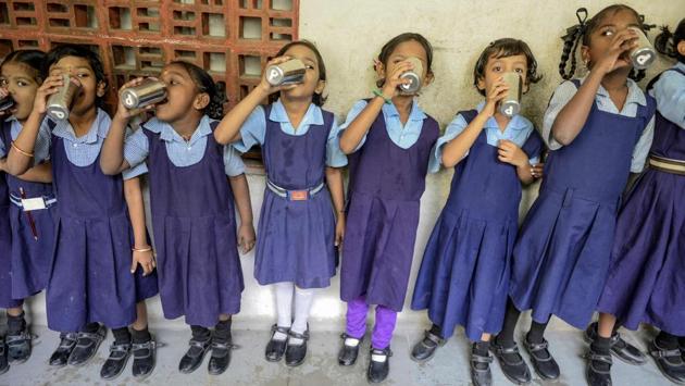 School children drink water during the launch ‘Water Bell’ programme launched by Telangana government, to ensure children drink sufficient water in the day, at a government-run school in Secunderabad, the twin city of Hyderabad, Telangana. (Noah Seelam / AFP)