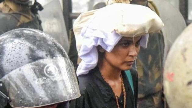 Activist Rehana Fathima being escorted by the police to Sabarimala temple in Kerala on October 19, 2018.(Photo: PTI)