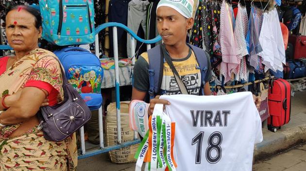 A vendor holding Virat Kohli’s Test shirt in Kolkata. (HT Photo/Aritra Mukherjee) A vendor holding Virat Kohli’s Test shirt in Kolkata. (HT Photo/Aritra Mukherjee)