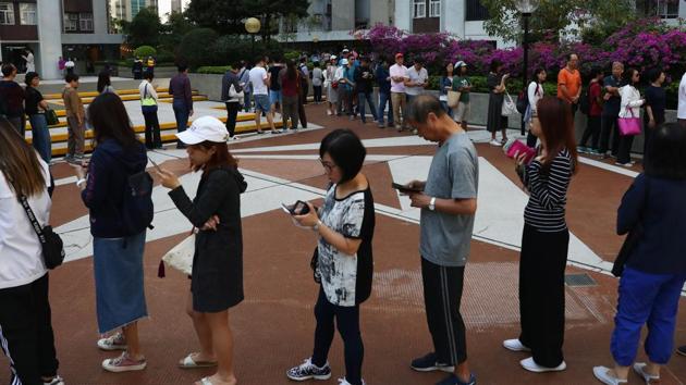Voters queue to vote at a polling station during district council local elections on Hong Kong Island, China. (REUTERS) Voters queue to vote at a polling station during district council local elections on Hong Kong Island, China. (REUTERS)