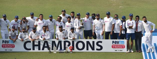 Indian team players pose with the trophy after winning the test series against Bangladesh by 2-0. (Samir Jana / Hindustan Times)