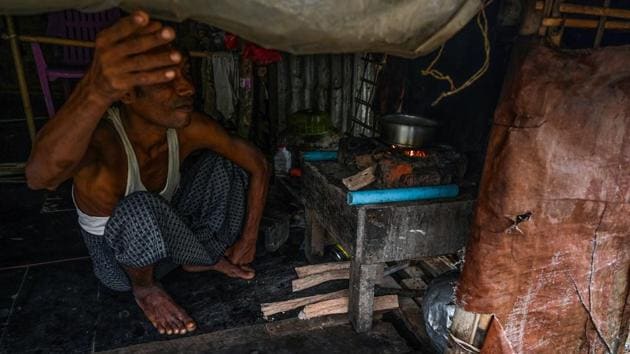 A Muslim man cooks in his tent in Kyauktalone camp in Kyaukphyu. In the 2012 unrest, mobs ransacked homes and police rounded up Muslims for their “own safety” to sites that would later be turned into camps. More than 200 Muslims died, tens of thousands were displaced and the stage was set for the bloody purge of hundreds of thousands of Rohingya Muslims in northern Rakhine five years later. (Ye Aung Thu / AFP)
