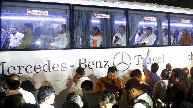 NCP MLAs leave in a bus after a meeting with party MLAs in Mumbai, Saturday, Nov. 23, 2019. At least nine NCP MLAs who attended swearing-in of Ajit Pawar as deputy chief minister of Maharashtra returned to the party fold and expressed solidarity with party chief Sharad Pawar.(PTI)