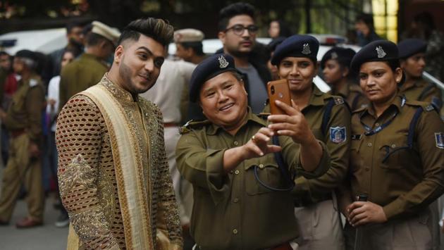 Police personnel take selfies with a participant in the pride parade. Owing to the large number of marchers, a number of police personnel were deployed to ensure that the route of the pride is bereft of traffic, and that the people move ahead smoothly. However, the LGBTQ community in India is yet to get marriage rights, adoption rights, among other fundamental human rights. (Amal KS / HT Photo) Police personnel take selfies with a participant in the pride parade. Owing to the large number of marchers, a number of police personnel were deployed to ensure that the route of the pride is bereft of traffic, and that the people move ahead smoothly. However, the LGBTQ community in India is yet to get marriage rights, adoption rights, among other fundamental human rights. (Amal KS / HT Photo)