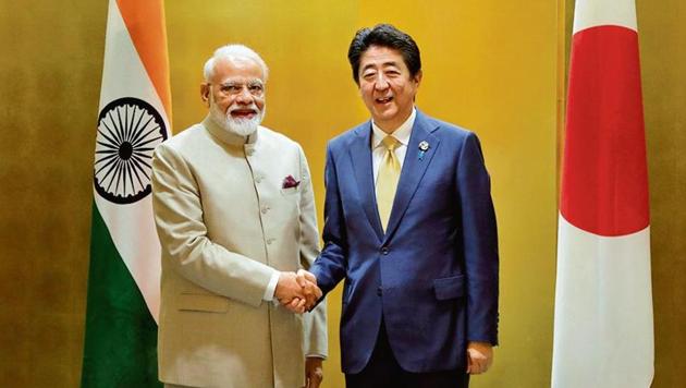 PM Narendra Modi with Japan PM Shinzo Abe during a meeting ahead of the G-20 summit in Japan on June 27.(Reuters)