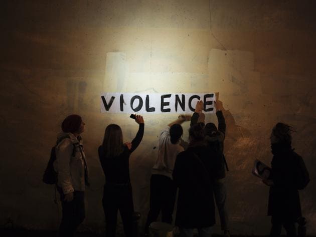 The word "violence" is pasted onto a wall by a group of women in a dark street in Paris. In Paris and cities across France, the signs are everywhere. "Complaints ignored, women killed" and "She leaves him, he kills her," they read in black block letters pasted over stately municipal buildings, drawing attention to the country’s high domestic violence rate. (Kamil Zihnioglu / AP) The word "violence" is pasted onto a wall by a group of women in a dark street in Paris. In Paris and cities across France, the signs are everywhere. "Complaints ignored, women killed" and "She leaves him, he kills her," they read in black block letters pasted over stately municipal buildings, drawing attention to the country’s high domestic violence rate. (Kamil Zihnioglu / AP)