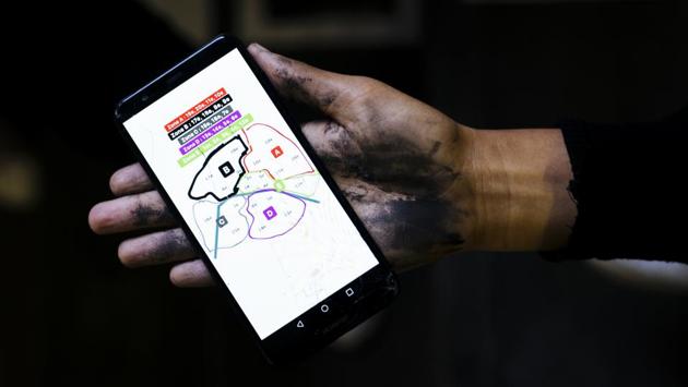 Maya holds her phone showing a map of Paris as she explains how the women of the movement divided Paris into five different pasting zones. On Monday, the government will announce measures that are expected to include seizing firearms from people suspected of domestic violence, prioritizing police training and formally recognizing “psychological violence” as a form of domestic violence. (Kamil Zihnioglu / AP) Maya holds her phone showing a map of Paris as she explains how the women of the movement divided Paris into five different pasting zones. On Monday, the government will announce measures that are expected to include seizing firearms from people suspected of domestic violence, prioritizing police training and formally recognizing “psychological violence” as a form of domestic violence. (Kamil Zihnioglu / AP)