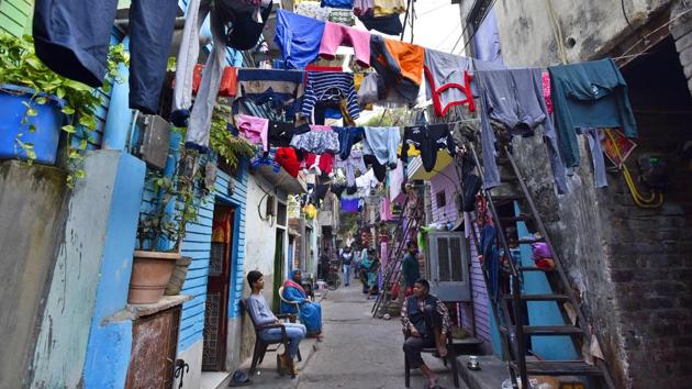 Clothes are hung on ropes to dry at Raghubir Nagar in New Delhi. The locality is home to members of the Waghri community who barter new utensils for old clothes, and then sell these used clothes to roadside vendors and traders who come to the colony’s second-hand clothes market, known as Ghoda Mandi --organised every morning between 4 am and 8 am. (Sanjeev Verma / HT Photo) Clothes are hung on ropes to dry at Raghubir Nagar in New Delhi. The locality is home to members of the Waghri community who barter new utensils for old clothes, and then sell these used clothes to roadside vendors and traders who come to the colony’s second-hand clothes market, known as Ghoda Mandi --organised every morning between 4 am and 8 am. (Sanjeev Verma / HT Photo)