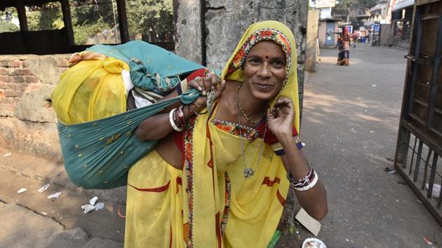 A woman carries a bundle of clothes on her back. “Traders come from as far as Bihar, Uttar Pradesh, Nepal, to Delhi because they get used clothes of the best quality here,” Jayanti said. And the reason, the community members say, is Delhiites’ love for new clothes. Delhiites spend a lot on clothes, but discard them once they wear out, giving the bartanwalis the opportunity to barter them for utensils. (Sanjeev Verma / HT Photo) A woman carries a bundle of clothes on her back. “Traders come from as far as Bihar, Uttar Pradesh, Nepal, to Delhi because they get used clothes of the best quality here,” Jayanti said. And the reason, the community members say, is Delhiites’ love for new clothes. Delhiites spend a lot on clothes, but discard them once they wear out, giving the bartanwalis the opportunity to barter them for utensils. (Sanjeev Verma / HT Photo)