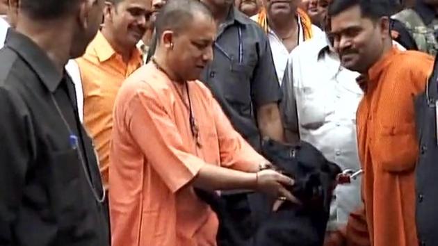 Yogi Adityanath, chief minister of Uttar Pradesh, with his pet dog Kalu. (Twitter/ANI) Yogi Adityanath, chief minister of Uttar Pradesh, with his pet dog Kalu. (Twitter/ANI)