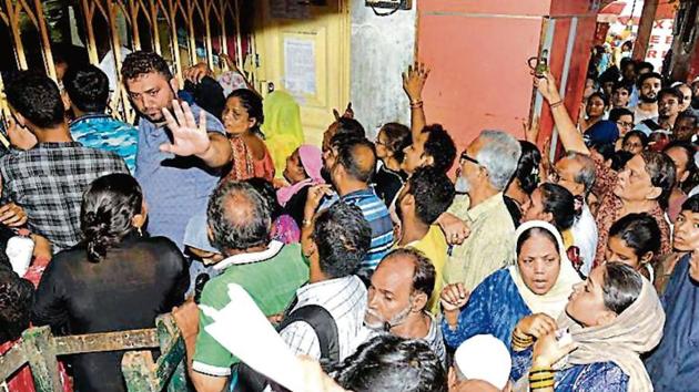 People queue up for a Digital Ration Card form in Kolkata. The West Bengal government began digitising ration cards in September.(Samir Jana/HT Archive)