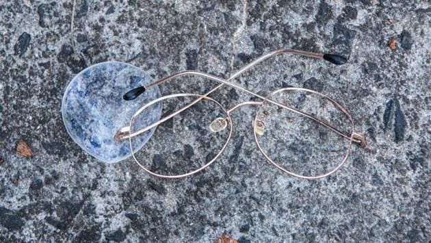 A pair of damaged spectacles are seen on a road outside the main entrance of the Hong Kong Polytechnic University campus. The university became the focus of the city’s pro-democracy movement a week ago, when dug-in demonstrators clashed violently with riot police until November 19. (Anthony Wallace / AFP) A pair of damaged spectacles are seen on a road outside the main entrance of the Hong Kong Polytechnic University campus. The university became the focus of the city’s pro-democracy movement a week ago, when dug-in demonstrators clashed violently with riot police until November 19. (Anthony Wallace / AFP)