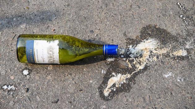 A Molotov cocktail is seen on a road outside the main entrance of the campus. Equally omnipresent in the campus are the primitive Molotovs used by protesters -- flammable materials contained in wine and beer bottles, as well as butane fuel canisters -- as well as umbrellas, hard hats, swimming goggles, and even a fencing mask for protection against police projectiles. (Anthony Wallace / AFP) A Molotov cocktail is seen on a road outside the main entrance of the campus. Equally omnipresent in the campus are the primitive Molotovs used by protesters -- flammable materials contained in wine and beer bottles, as well as butane fuel canisters -- as well as umbrellas, hard hats, swimming goggles, and even a fencing mask for protection against police projectiles. (Anthony Wallace / AFP)