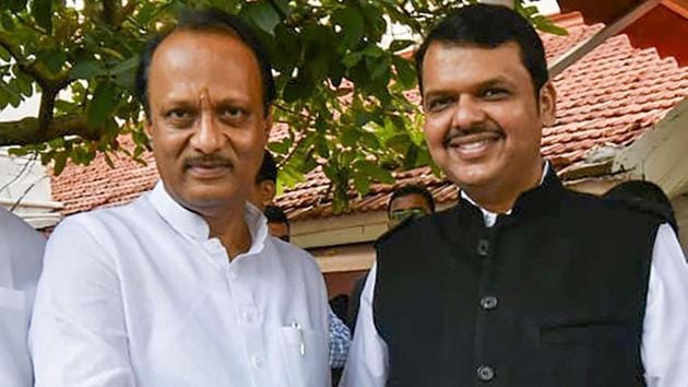 Mumbai: Newly-sworn in Chief Minister of Maharashtra Devendra Fadnavis shakes hands with his Deputy Chief Minister Ajit Pawar, in Mumbai, Saturday, Nov. 23, 2019. (PTI Photo) (PTI11_23_2019_000058A)(PTI) Mumbai: Newly-sworn in Chief Minister of Maharashtra Devendra Fadnavis shakes hands with his Deputy Chief Minister Ajit Pawar, in Mumbai, Saturday, Nov. 23, 2019. (PTI Photo) (PTI11_23_2019_000058A)(PTI)