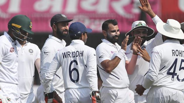 India's Mohammed Shami, third right, celebrates with teammates the dismissal of Bangladesh's Mahmudullah.(AP)