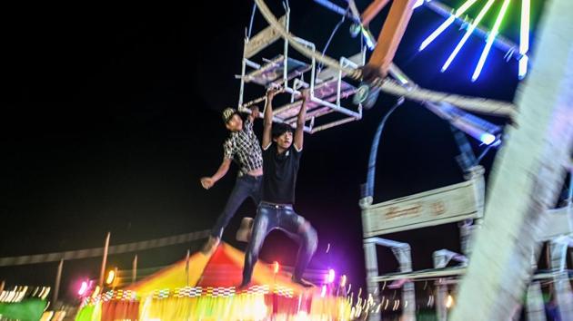 Photos: Riding high on Myanmar s human powered Ferris wheels