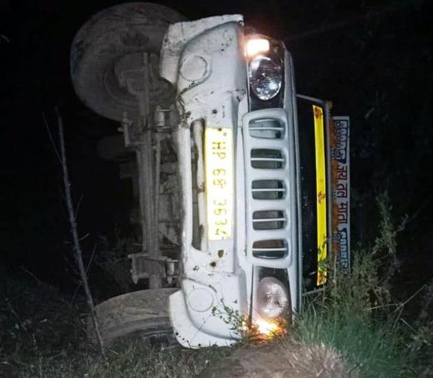The jeep that doubled up as a goods carrier rolled back a steep ascent in Shahpur sub division of Kangra district. The accident could have been fatal had the vehicle not hit a tree while rolling down the hill.(HT Photo) The jeep that doubled up as a goods carrier rolled back a steep ascent in Shahpur sub division of Kangra district. The accident could have been fatal had the vehicle not hit a tree while rolling down the hill.(HT Photo)
