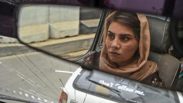 Dalili is reflected in the rear-view mirror as she waits for women passengers. According to Khan Mohammad Shinwaray, police chief at Kabul’s traffic department, the number of women drivers in the capital has been steadily growing, with 275 licences approved for the first half of the year. This is quite a jump: In the years between 2012 and 2016, just 1,189 women in total got licences in the city. (Wakil Kohsar / AFP) Dalili is reflected in the rear-view mirror as she waits for women passengers. According to Khan Mohammad Shinwaray, police chief at Kabul’s traffic department, the number of women drivers in the capital has been steadily growing, with 275 licences approved for the first half of the year. This is quite a jump: In the years between 2012 and 2016, just 1,189 women in total got licences in the city. (Wakil Kohsar / AFP)