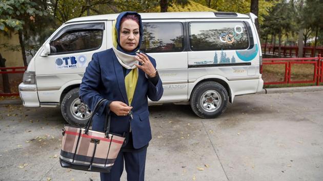 Parisa Haidary walks away from a mini-bus dropping off her women passengers in Kabul. The 36-year-old former beautician, who has also worked as a TV journalist, and other women drivers -- her colleagues -- were chosen from 100 candidates. “We get a lot of different reactions,” she said. “Some drivers block our way, others honk at us, some even drive alongside at the same speed when the road is clear.” (Wakil Kohsar / AFP) Parisa Haidary walks away from a mini-bus dropping off her women passengers in Kabul. The 36-year-old former beautician, who has also worked as a TV journalist, and other women drivers -- her colleagues -- were chosen from 100 candidates. “We get a lot of different reactions,” she said. “Some drivers block our way, others honk at us, some even drive alongside at the same speed when the road is clear.” (Wakil Kohsar / AFP)