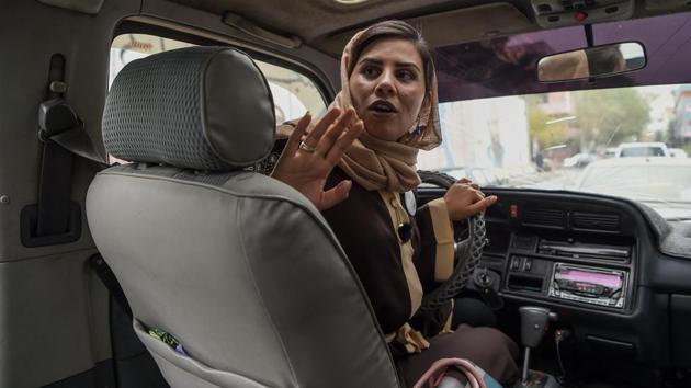 Dalili looks back as she talks to her passengers. When Taliban insurgents swept to power in 1996, women were forced to stay home, barred from most jobs, and deprived of their right to an education. After the militants were toppled in late 2001 and a US-backed government took over, gender equality was enshrined in the Afghan constitution, though discrimination remains rife. (Wakil Kohsar / AFP) Dalili looks back as she talks to her passengers. When Taliban insurgents swept to power in 1996, women were forced to stay home, barred from most jobs, and deprived of their right to an education. After the militants were toppled in late 2001 and a US-backed government took over, gender equality was enshrined in the Afghan constitution, though discrimination remains rife. (Wakil Kohsar / AFP)