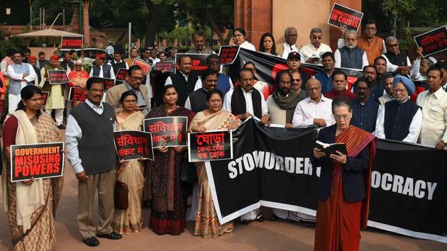 The Congress protested vociferously both inside and outside Parliament on November 25 against the political developments in Maharashtra as it stalled proceedings and accused the BJP of “murdering democracy” in the state. Opposition parties, including the Congress and the Shiv Sena, skipped a joint sitting of both Houses of Parliament on Constitution Day to mark their protest against the BJP’s alleged high-handedness in Maharashtra. (Mohd Zakir / HT Photo)